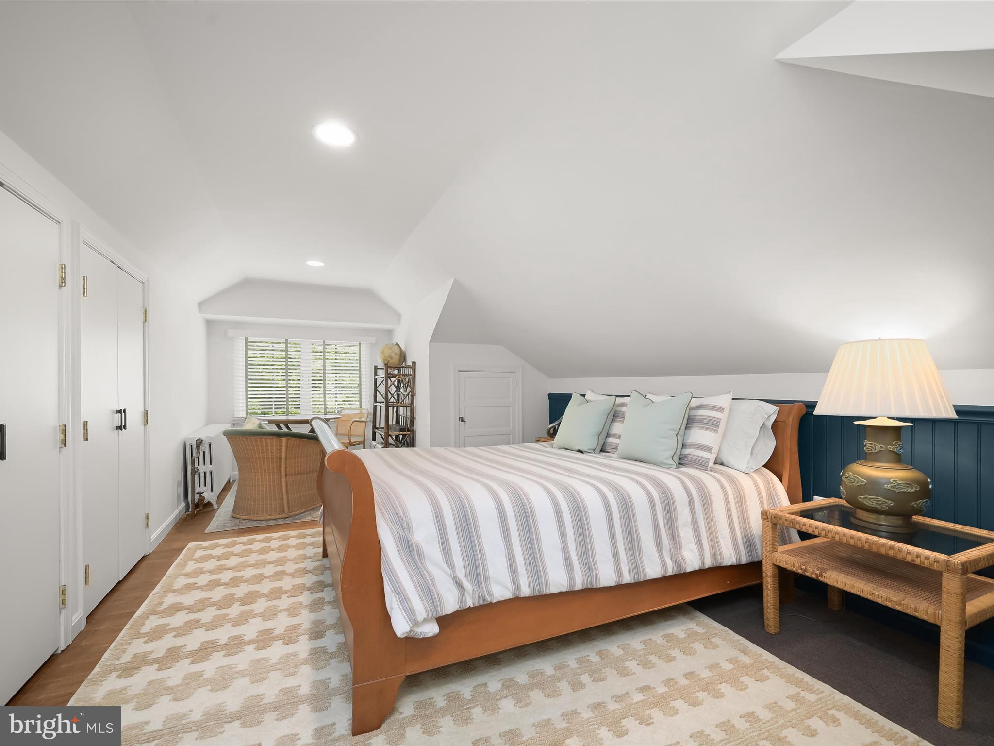 112 Park Drive Baltimore, MD 21228 - Photo 42 of 86 a bedroom with a bed and a lamp