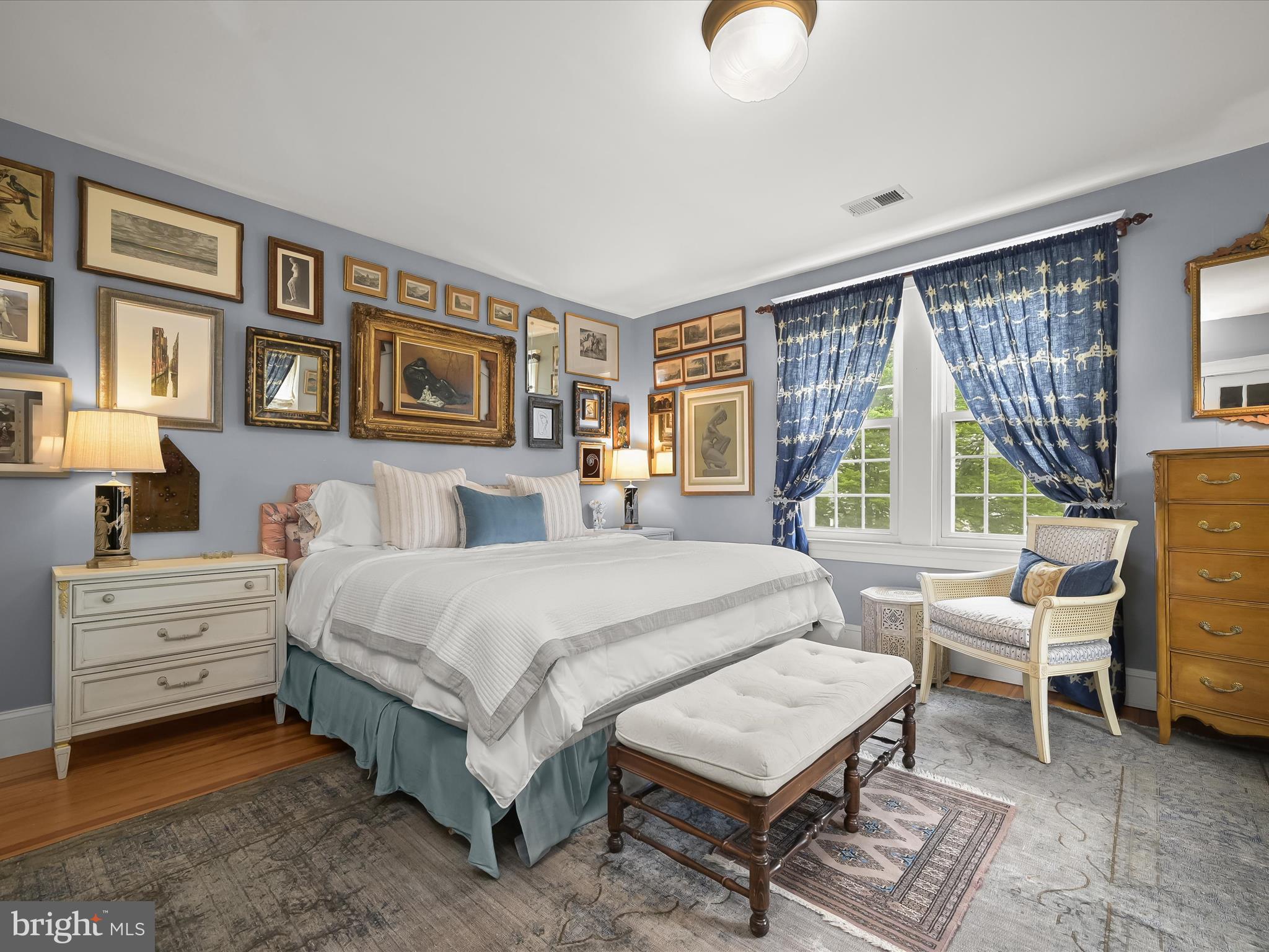 112 Park Drive Baltimore, MD 21228 - Photo 5 of 86 a spacious bedroom with a bed a table and large windows