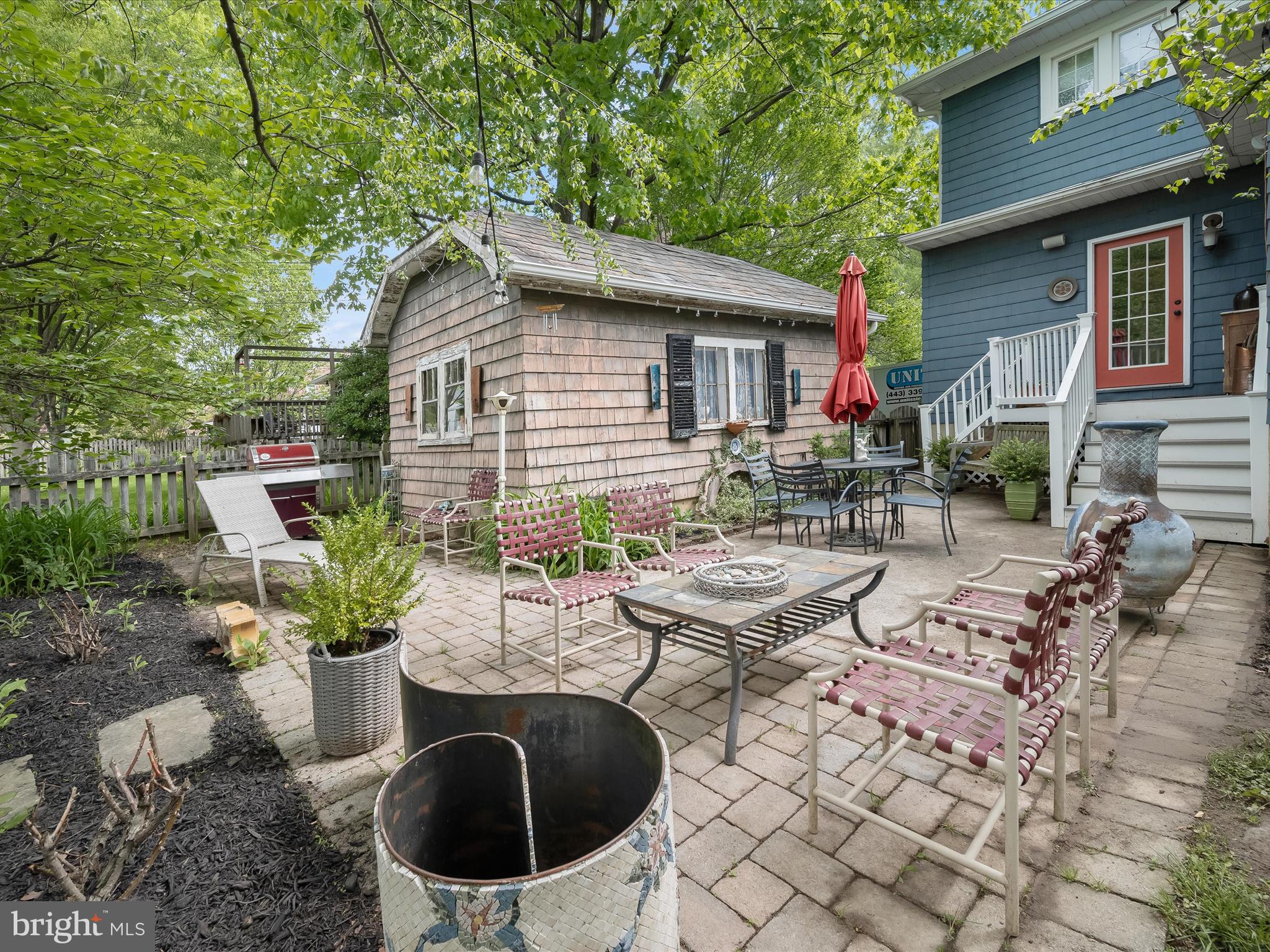 112 Park Drive Baltimore, MD 21228 - Photo 51 of 86 a view of backyard with outdoor seating and plants