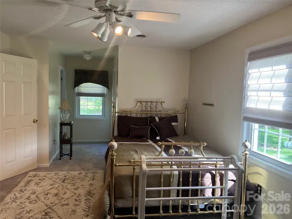 a bedroom with a bed and a table in it