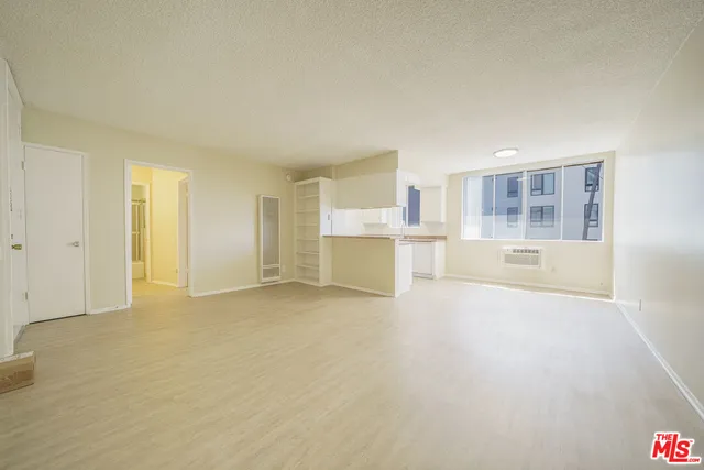 a view of a kitchen with a sink and cabinets