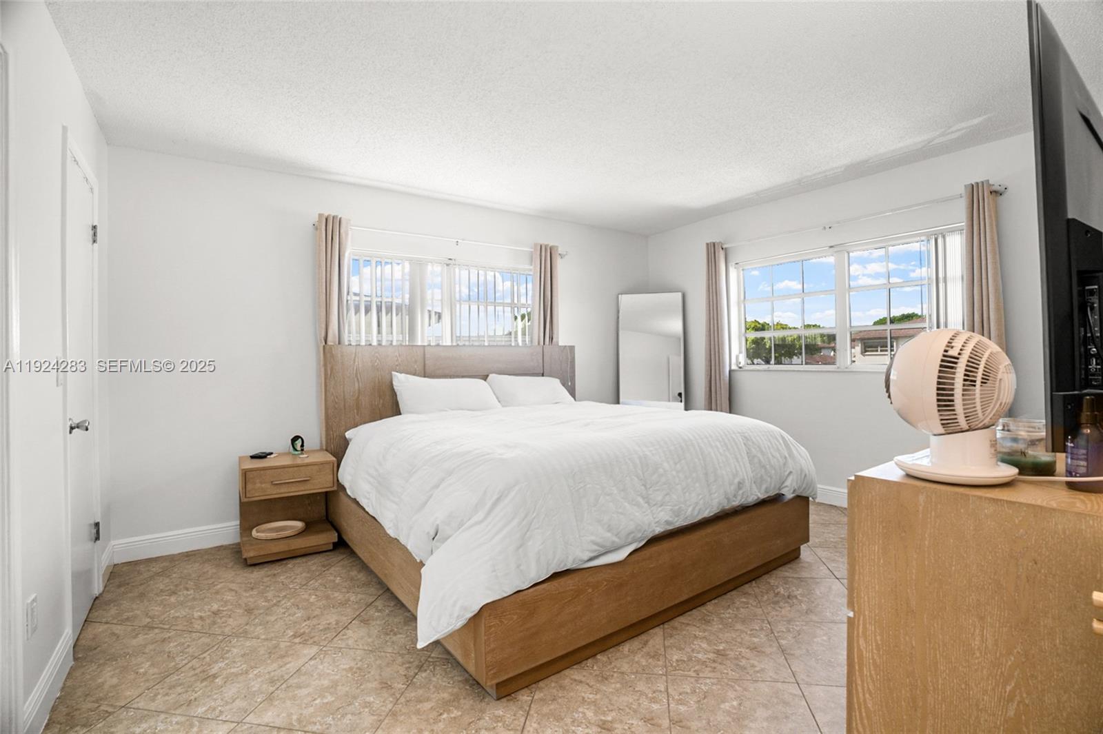 4605 Southwest 139th Court, Unit 814 Miami, FL 33175 - Photo 11 of 27 a bedroom with a bed and a window