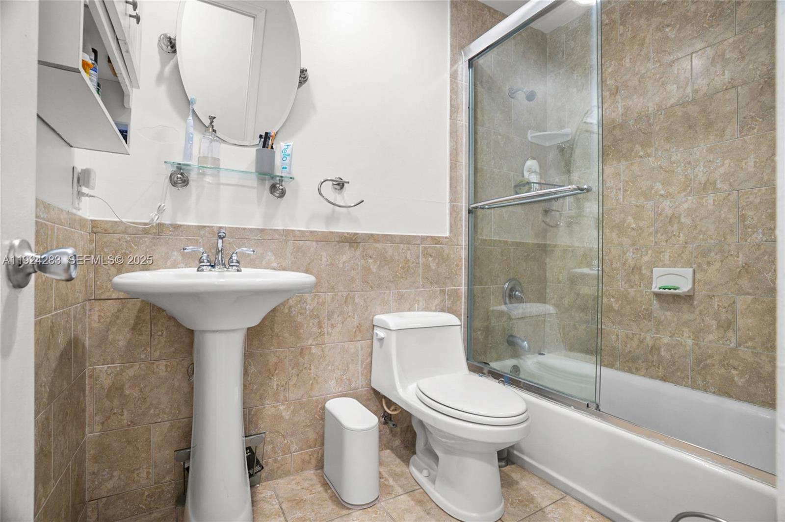 4605 Southwest 139th Court, Unit 814 Miami, FL 33175 - Photo 16 of 27 a bathroom with a sink toilet and shower