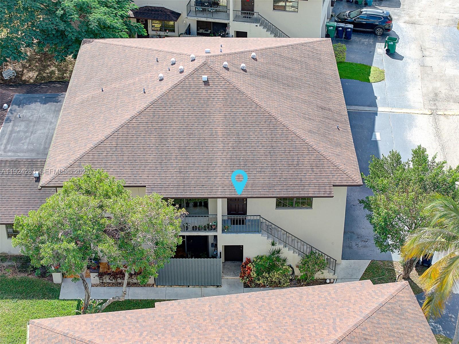 4605 Southwest 139th Court, Unit 814 Miami, FL 33175 - Photo 20 of 27 a aerial view of a house with a yard and potted plants