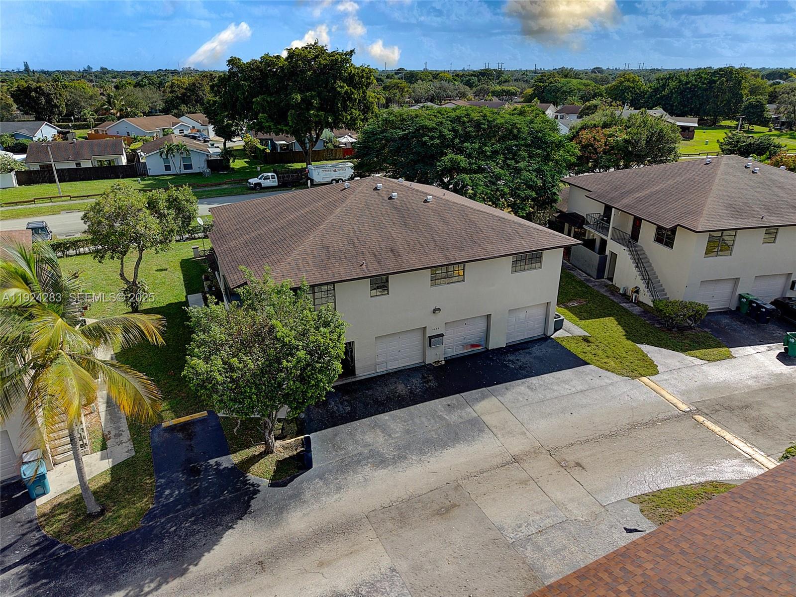 4605 Southwest 139th Court, Unit 814 Miami, FL 33175 - Photo 21 of 27 an aerial view of a house with a garden