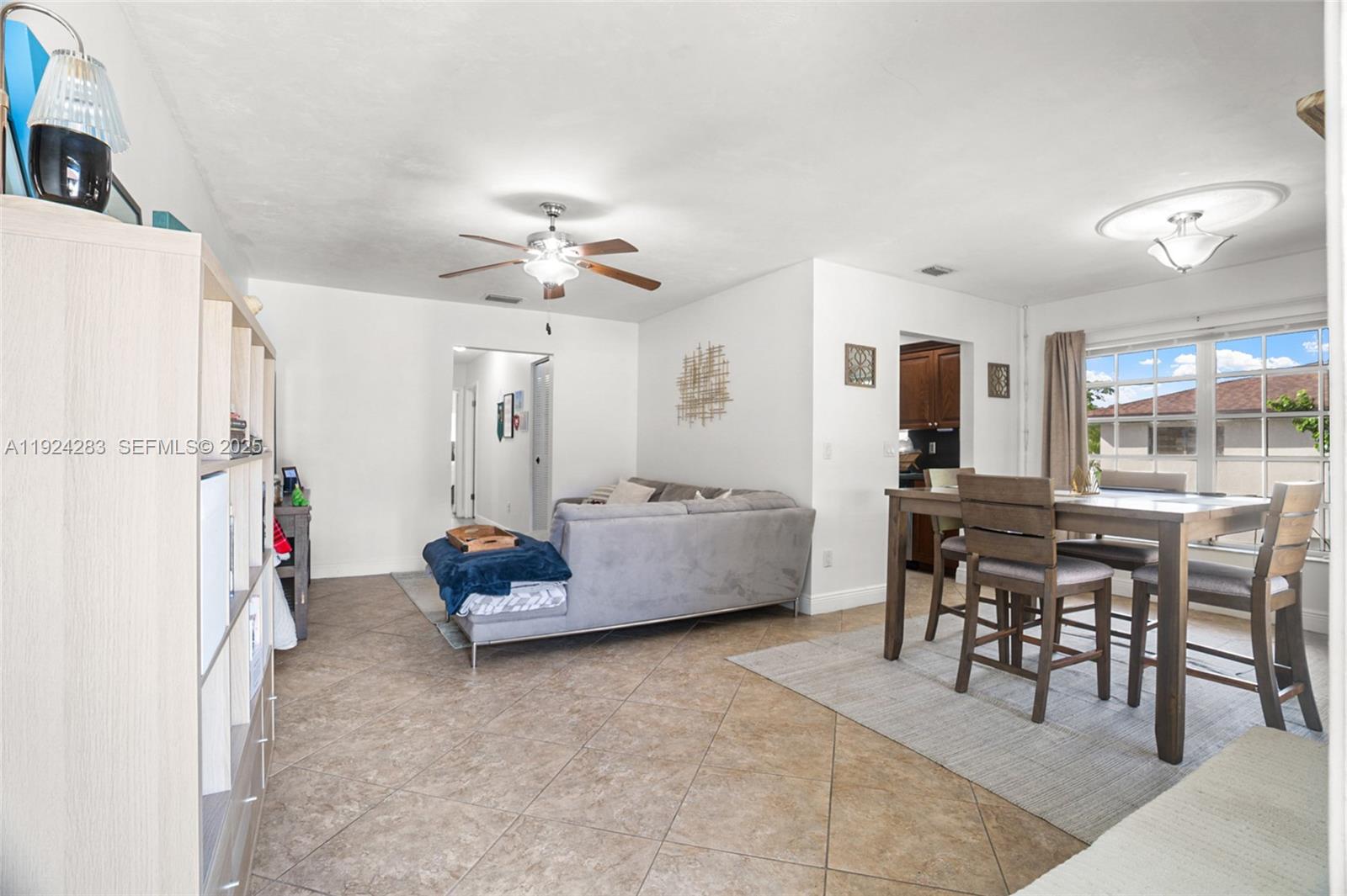 4605 Southwest 139th Court, Unit 814 Miami, FL 33175 - Photo 4 of 27 a living room with furniture and white walls