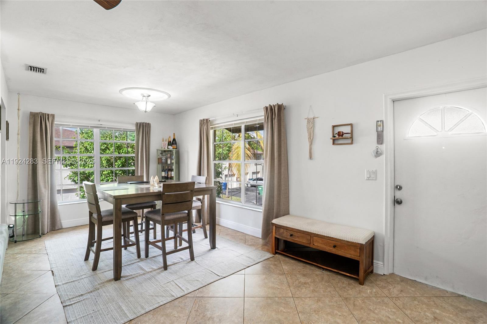 4605 Southwest 139th Court, Unit 814 Miami, FL 33175 - Photo 5 of 27 a dining room with furniture and window