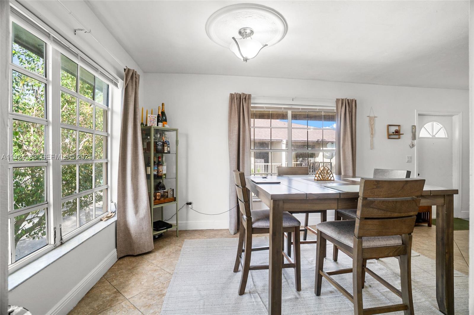 4605 Southwest 139th Court, Unit 814 Miami, FL 33175 - Photo 6 of 27 a view of a dining room with furniture window and outside view