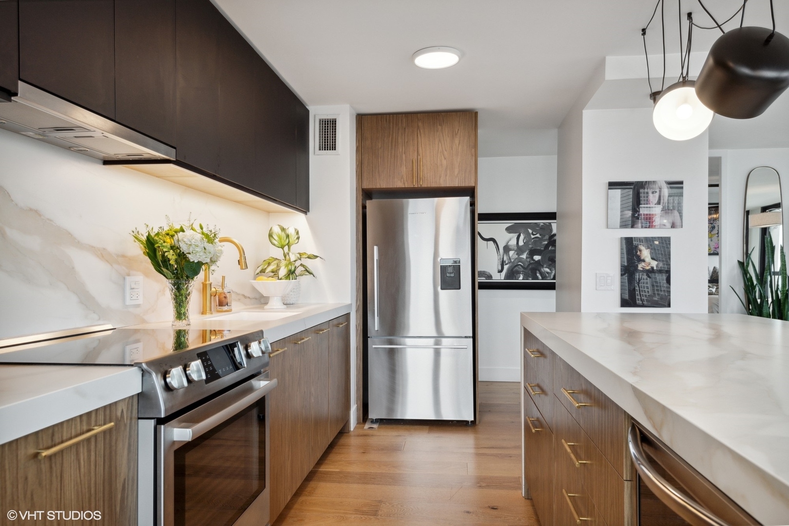 1030 North State Street, Unit 21E Chicago, IL 60610 - Photo 12 of 42 a kitchen with stainless steel appliances granite countertop a refrigerator and a stove