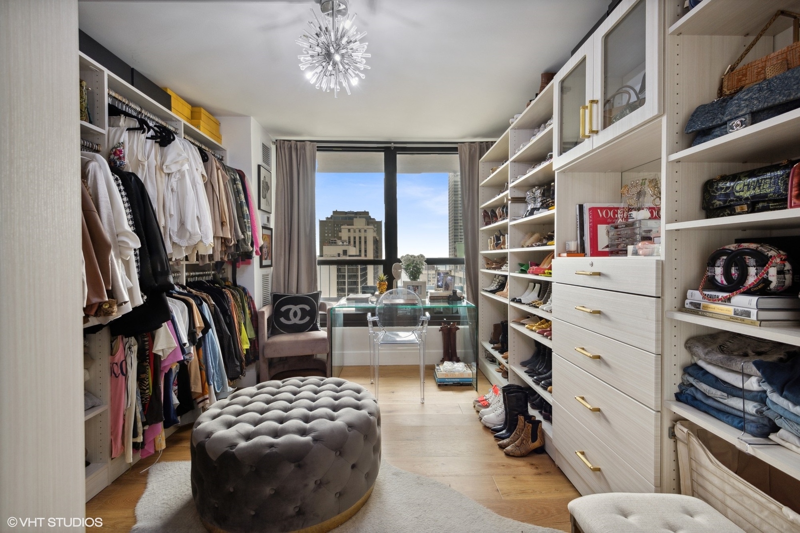 1030 North State Street, Unit 21E Chicago, IL 60610 - Photo 22 of 42 a view of walk in closet with clothes and shoes