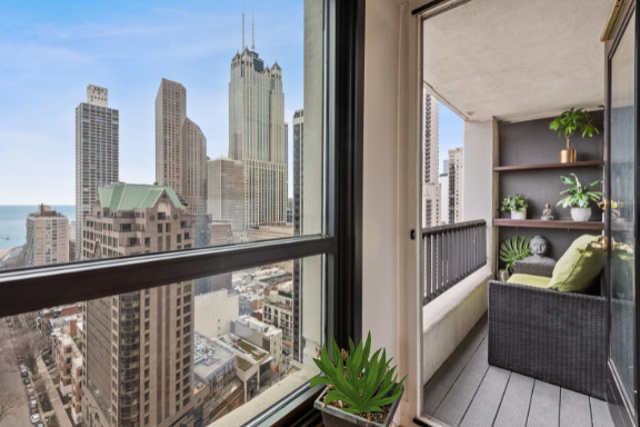 1030 North State Street, Unit 21E Chicago, IL 60610 - Photo 27 of 42 a view of a balcony with furniture