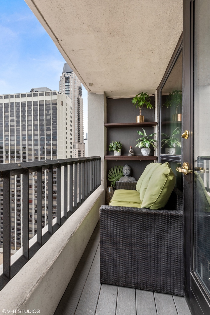 1030 North State Street, Unit 21E Chicago, IL 60610 - Photo 28 of 42 a view of balcony with couch
