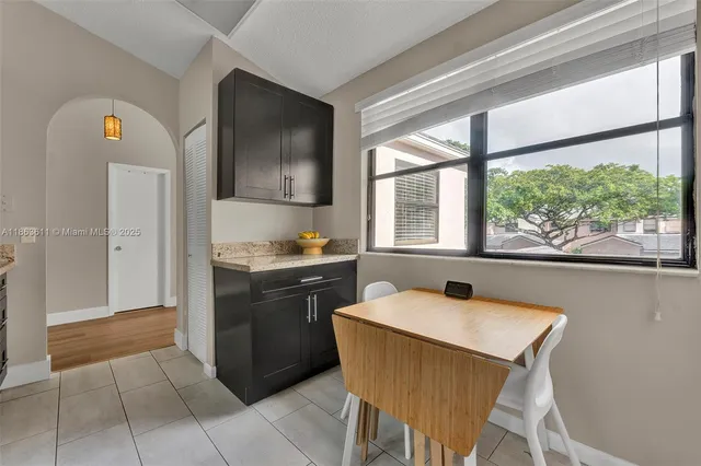 a kitchen with a stove a sink and a refrigerator
