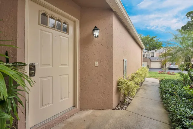 a view of a back yard with patio