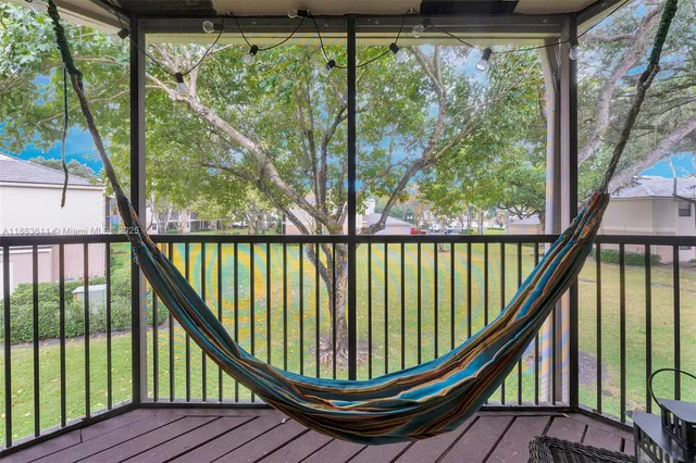 a view of balcony with wooden floor