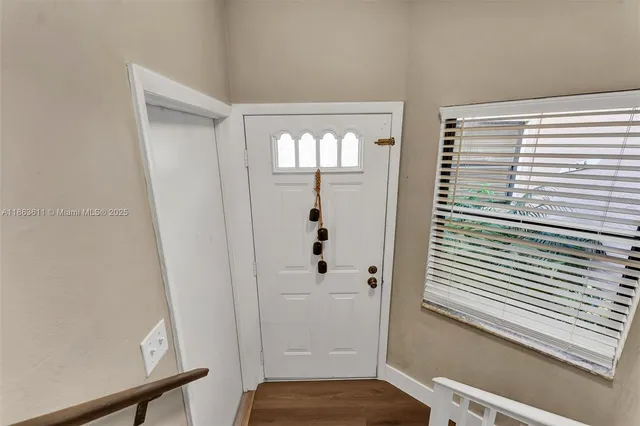 a view of a hallway with windows