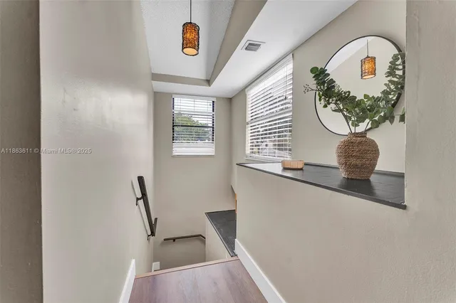 a view of a hallway with windows