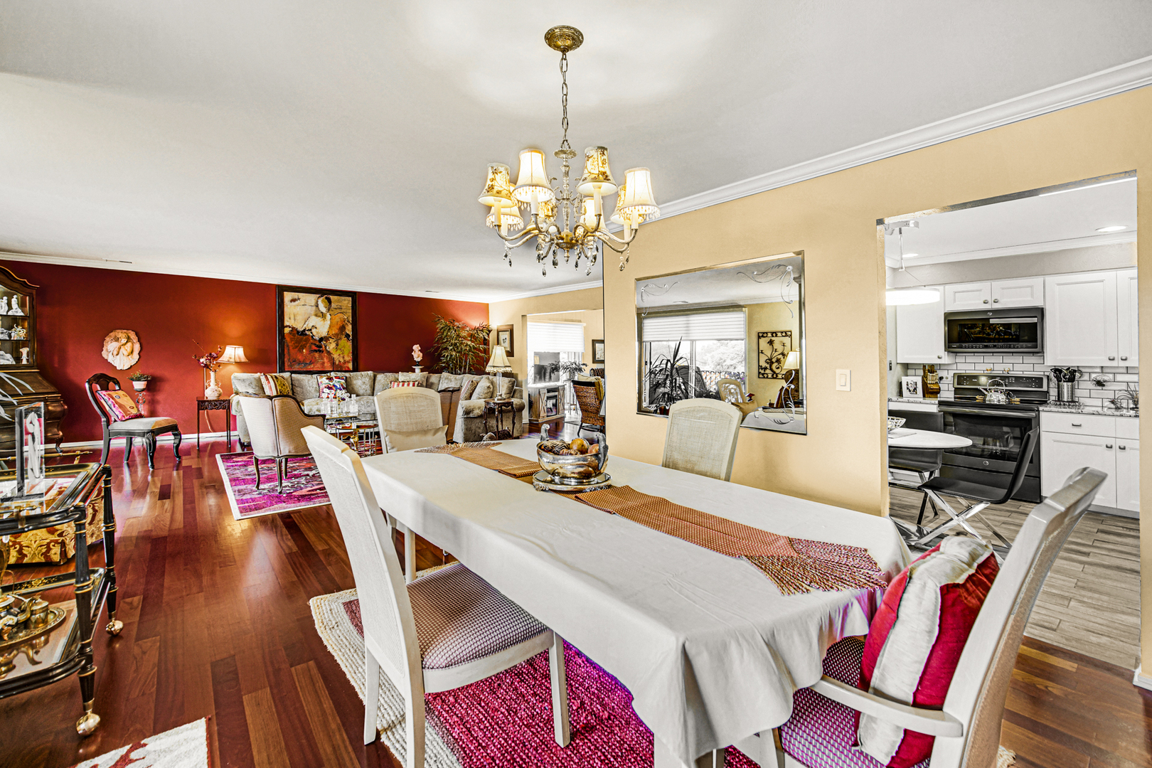 4000 Dundee Road, Unit 302 Northbrook, IL 60062 - Photo 3 of 12 a view of a dining room and livingroom with furniture wooden floor a chandelier