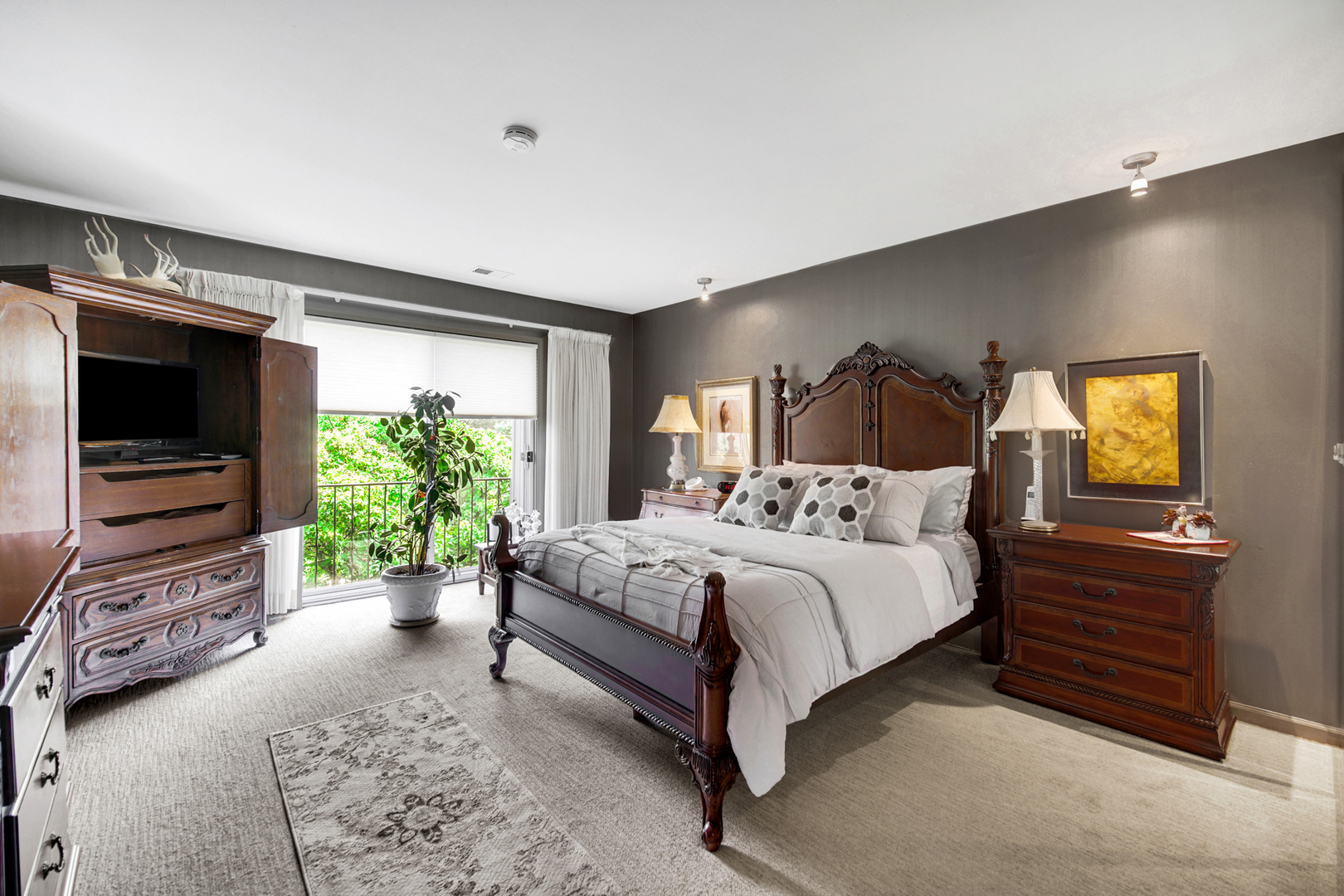 4000 Dundee Road, Unit 302 Northbrook, IL 60062 - Photo 6 of 12 a bed room with a bed and a television