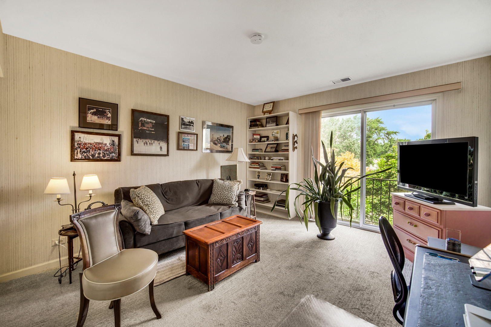 4000 Dundee Road, Unit 302 Northbrook, IL 60062 - Photo 9 of 12 a living room with furniture and a flat screen tv