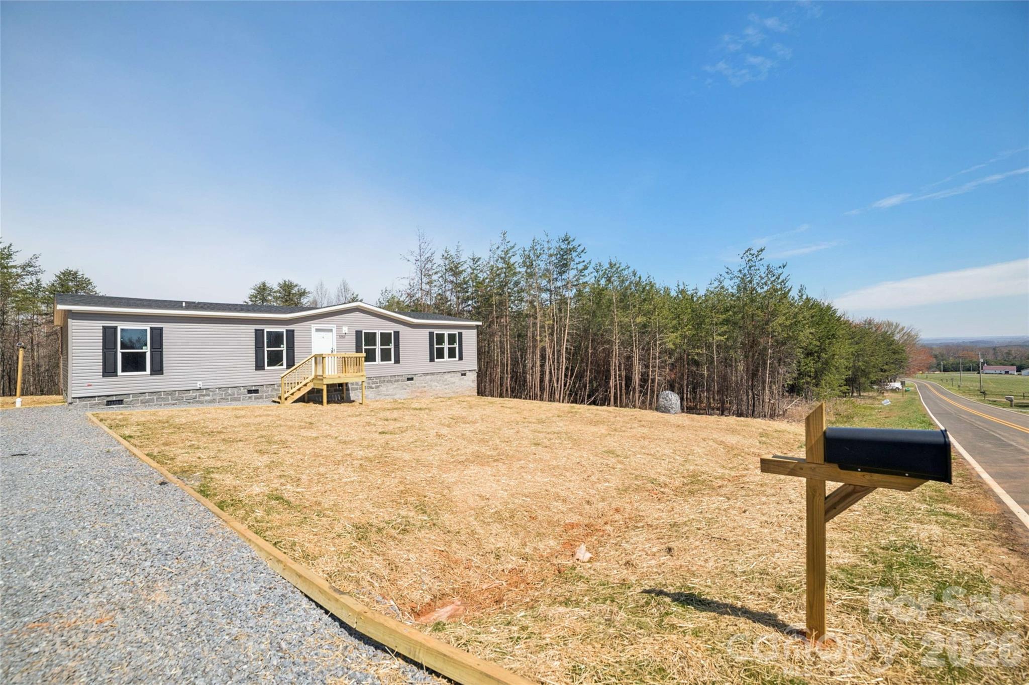 5350 Hope Road Vale, NC 28168 - Photo 2 of 24 a front view of a house with a yard
