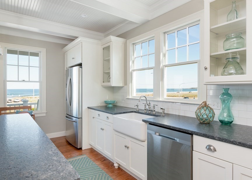 10 Whitehead Avenue Hull, MA 02045 - Photo 10 of 37 a kitchen with stainless steel appliances granite countertop a sink a refrigerator a window and white cabinets