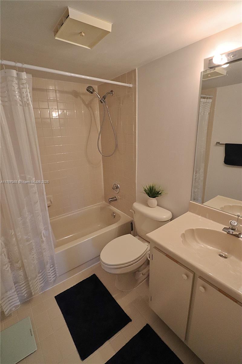 1206 North Hiatus Road, Unit 1206 Pembroke Pines, FL 33026 - Photo 14 of 18 a bathroom with a sink a toilet and shower