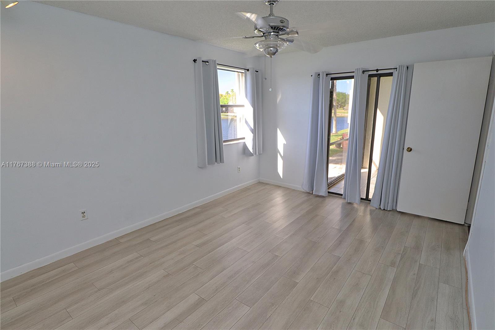 1206 North Hiatus Road, Unit 1206 Pembroke Pines, FL 33026 - Photo 9 of 18 a view of an empty room with a window
