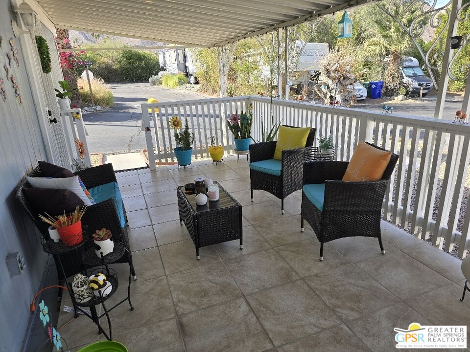 1 Running H Palm Desert, CA 92260 - Photo 16 of 22 a balcony with furniture and a potted plant