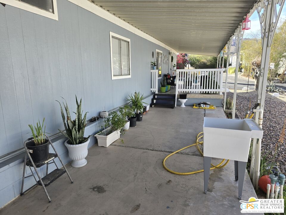 1 Running H Palm Desert, CA 92260 - Photo 17 of 22 a outdoor living space with furniture and a potted plant