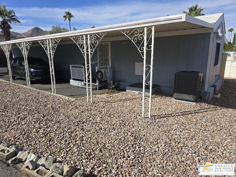 1 Running H Palm Desert, CA 92260 - Photo 19 of 22 a view of a house with a door