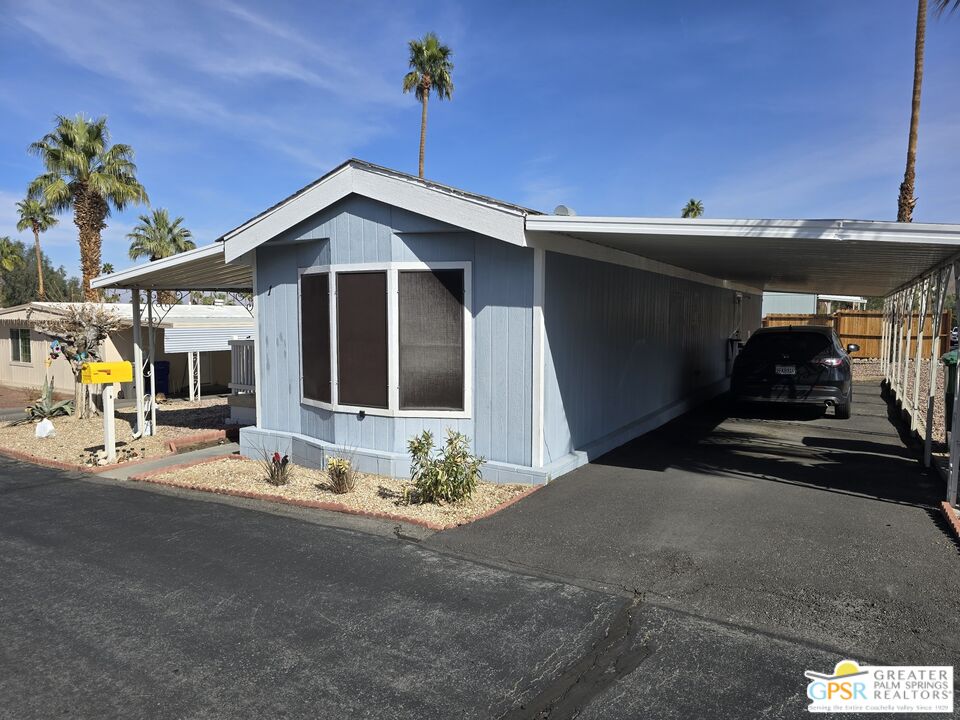 1 Running H Palm Desert, CA 92260 - Photo 2 of 22 a view of a house with patio area and potted plants
