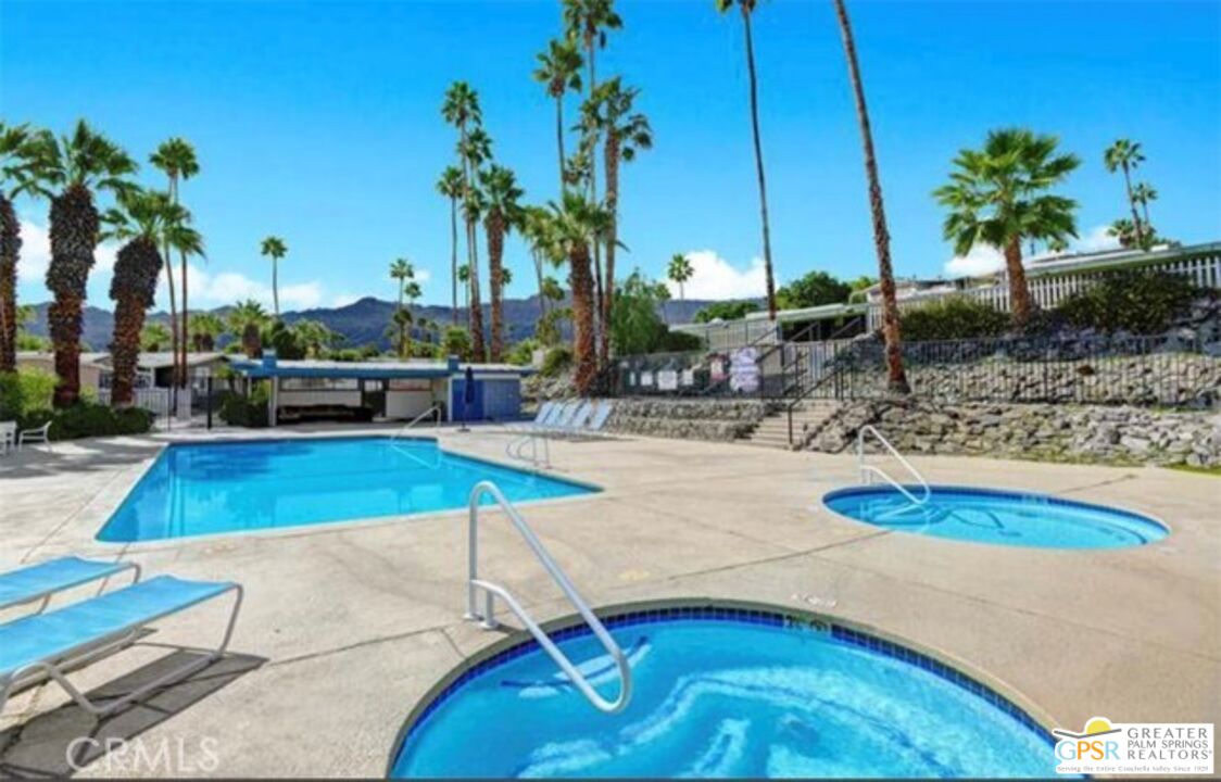 1 Running H Palm Desert, CA 92260 - Photo 22 of 22 a view of a swimming pool with a lounge chairs