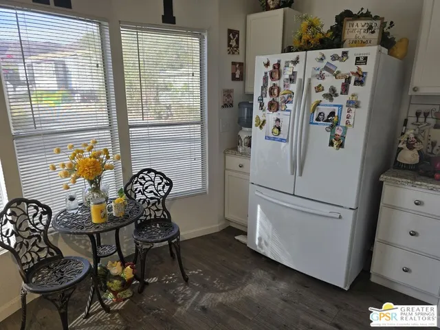 a white refrigerator freezer sitting inside of a kitchen