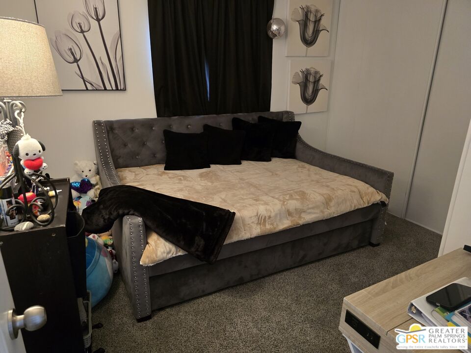 1 Running H Palm Desert, CA 92260 - Photo 10 of 22 a bed sitting in a bedroom next to a window with pc on the wall