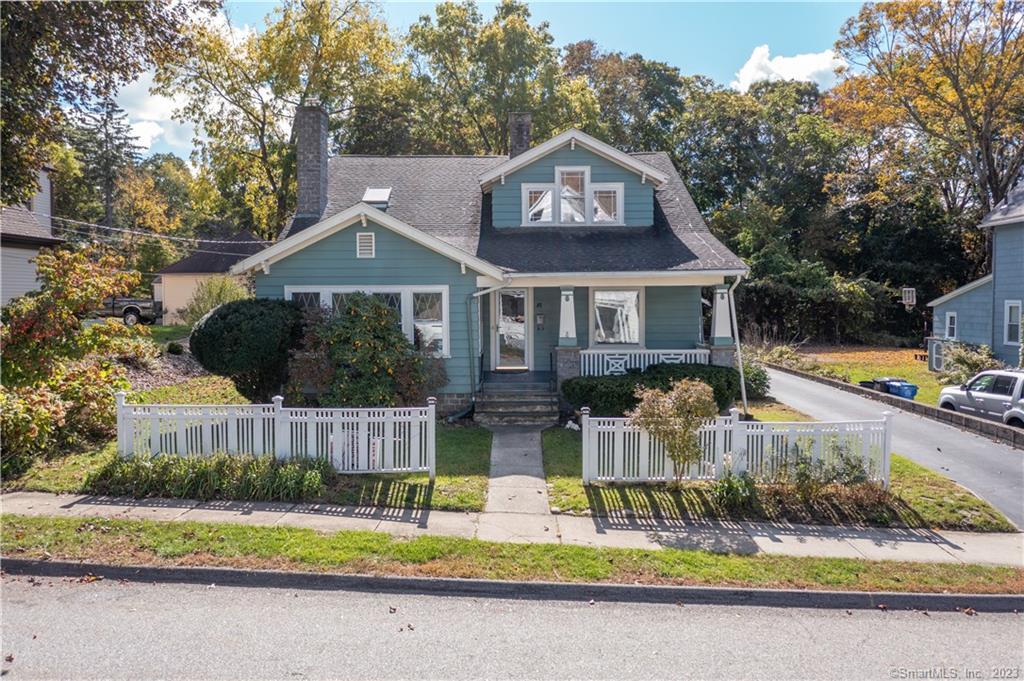81 Hawkins Street Killingly, CT 06239 - Photo 1 of 1 a front view of a house with a yard and garage
