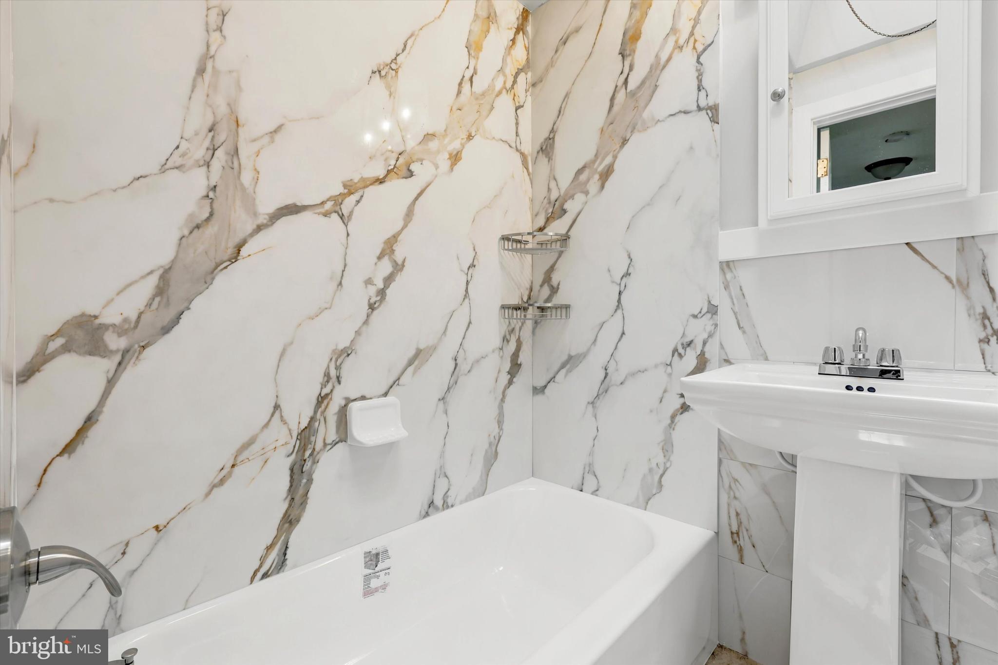2052 Heather Road Folcroft, PA 19032 - Photo 14 of 17 a bathroom with a sink and a mirror
