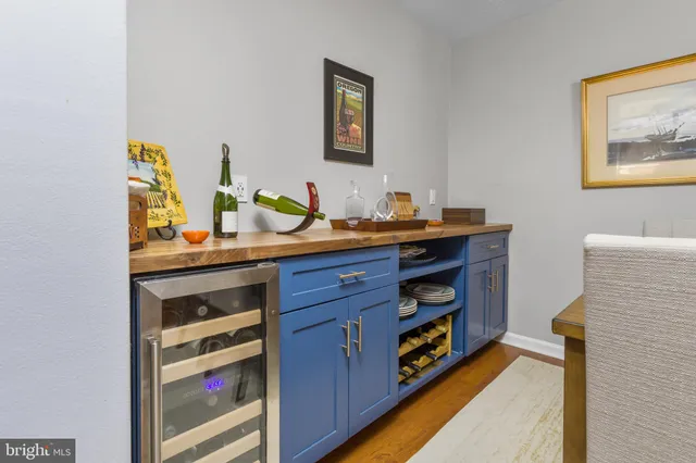 a workspace with furniture and mirror