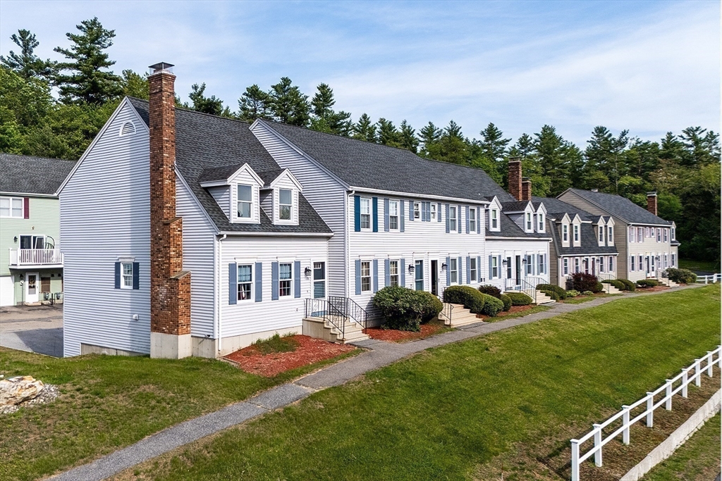 53 Century Way, Unit 53 Gardner, MA 01440 - Photo 2 of 22 a view of a house with a garden