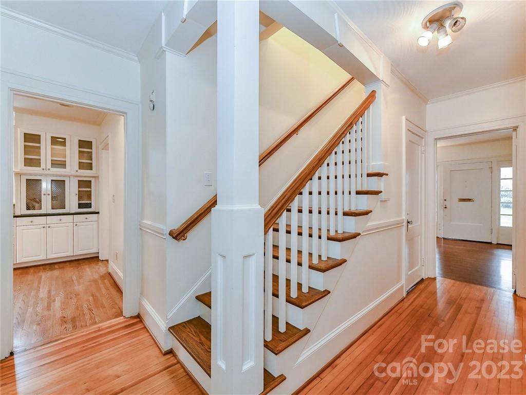 1923 Ewing Avenue Charlotte, NC 28203 - Photo 21 of 39 a view of an entryway with wooden floor and stairs
