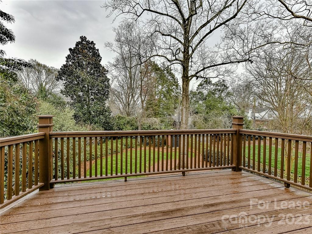 1923 Ewing Avenue Charlotte, NC 28203 - Photo 24 of 39 a view of balcony with wooden floor and fence
