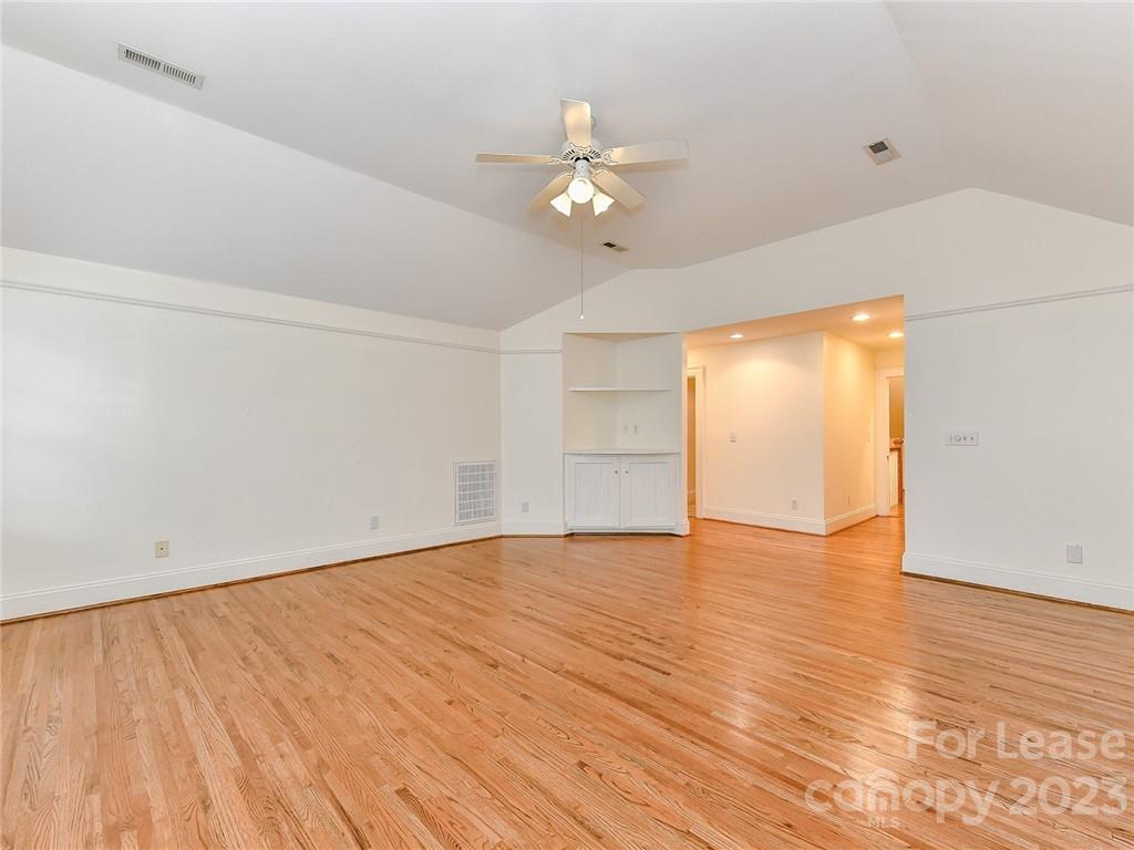 1923 Ewing Avenue Charlotte, NC 28203 - Photo 26 of 39 wooden floor in an empty room with a window