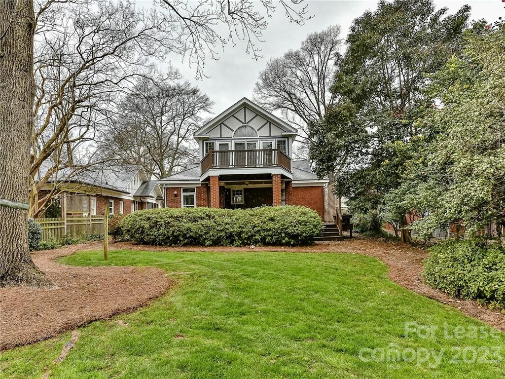 1923 Ewing Avenue Charlotte, NC 28203 - Photo 36 of 39 a front view of a house with a yard and garage