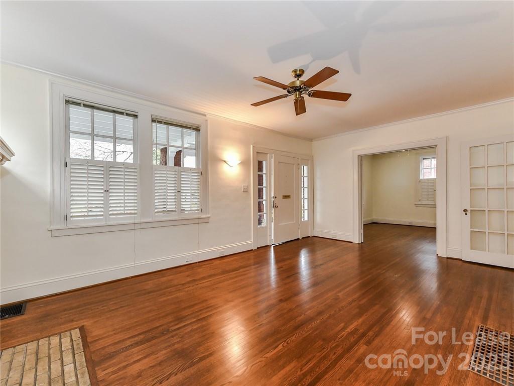 1923 Ewing Avenue Charlotte, NC 28203 - Photo 5 of 39 a view of empty room with wooden floor and window
