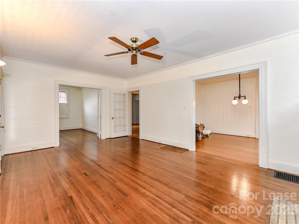 1923 Ewing Avenue Charlotte, NC 28203 - Photo 8 of 39 a view of an empty room and wooden floor