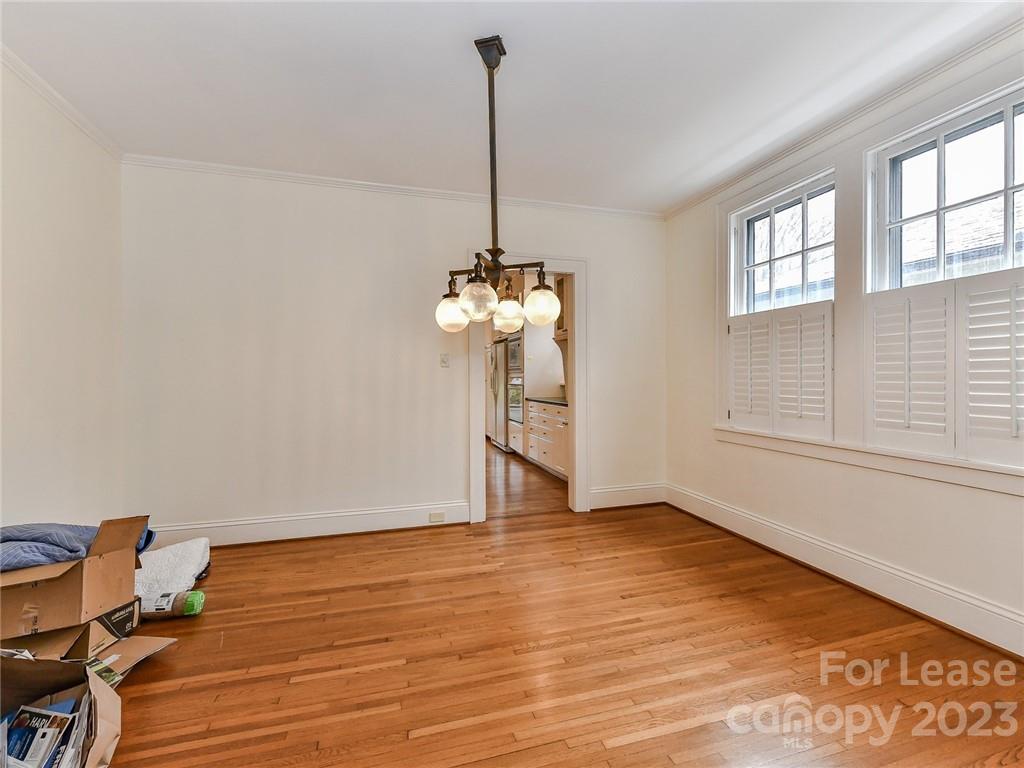 1923 Ewing Avenue Charlotte, NC 28203 - Photo 9 of 39 a view of a room with wooden floor closet and windows