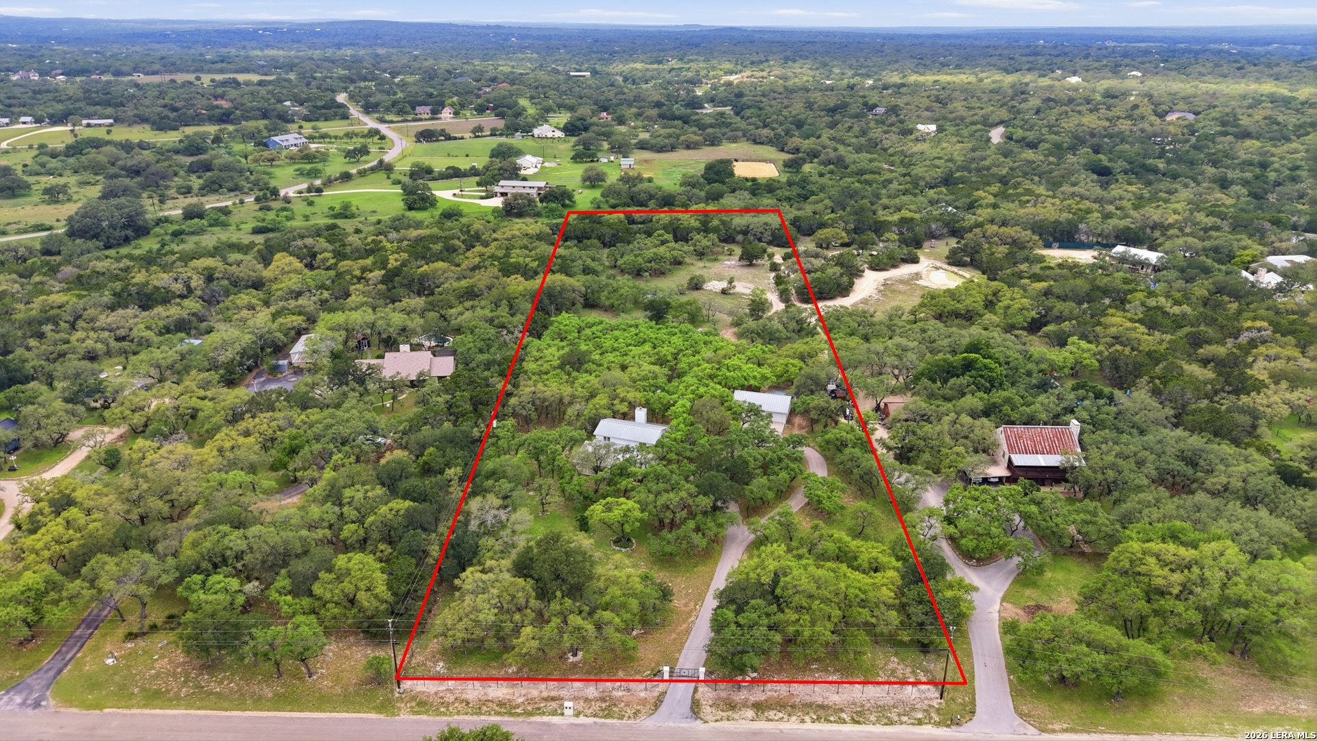 261 Fawn Lane Spring Branch, TX 78070 - Photo 44 of 44 an aerial view of residential houses with outdoor space and trees