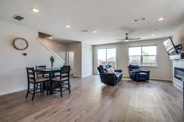 a view of a dining room with furniture window and wooden floor