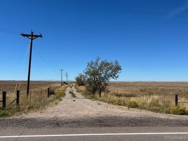 a view of a road with an ocean view