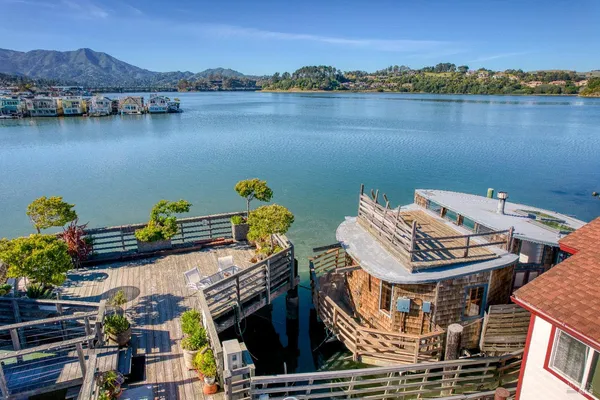 an aerial view of a house with a lake view